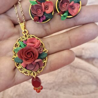 Floral elegance pendant with hand-shaped polymer clay flower bouquet in an ornate frame