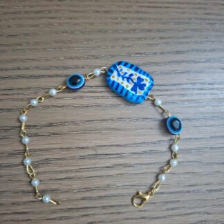 Pearl charm bracelet with hand-painted polymer clay botanical charm and pearl beads