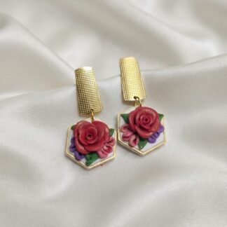 Statement earrings with hand-shaped wild rose clusters in polymer clay