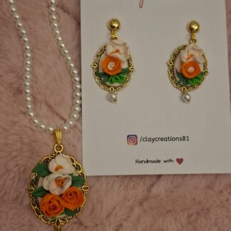 Midnight rose oval pendant, hand-painted polymer clay rose on a deep background